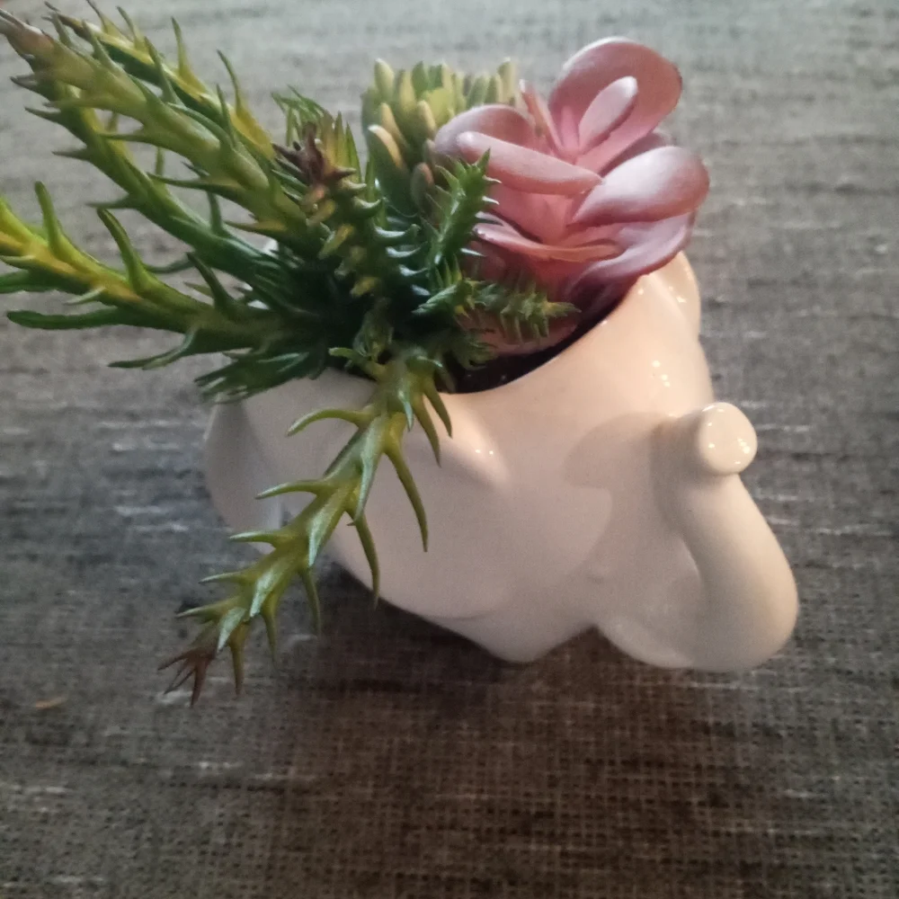 New elephant with faux plant